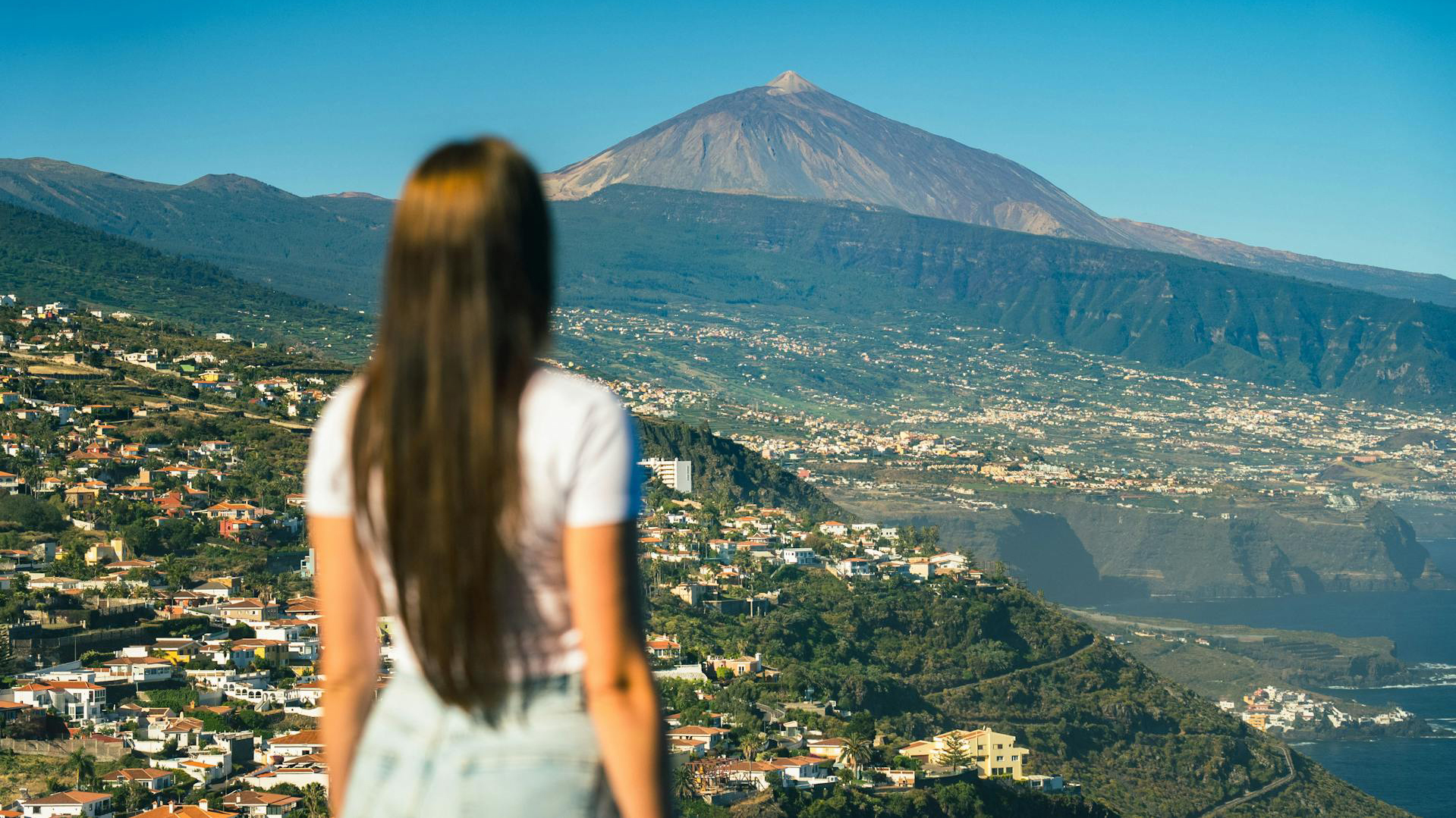 Woman hiking in Tenerife with ocean view